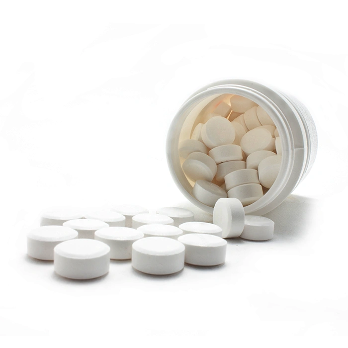 White medicines flow from container.