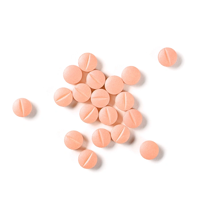 Pink pills, medicine isolated on white background
