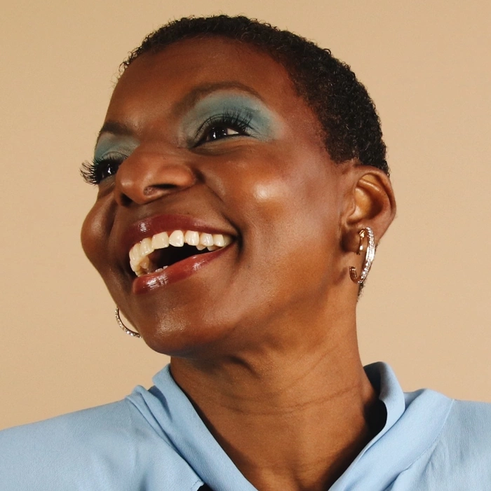 Portrait of Woman in Blue Make Up Smiling