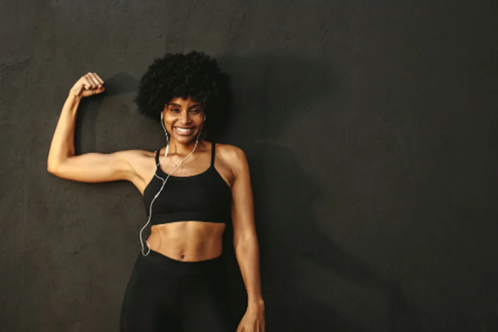Woman doing strength training exercises to combat estrogen loss and maintain muscle during menopause