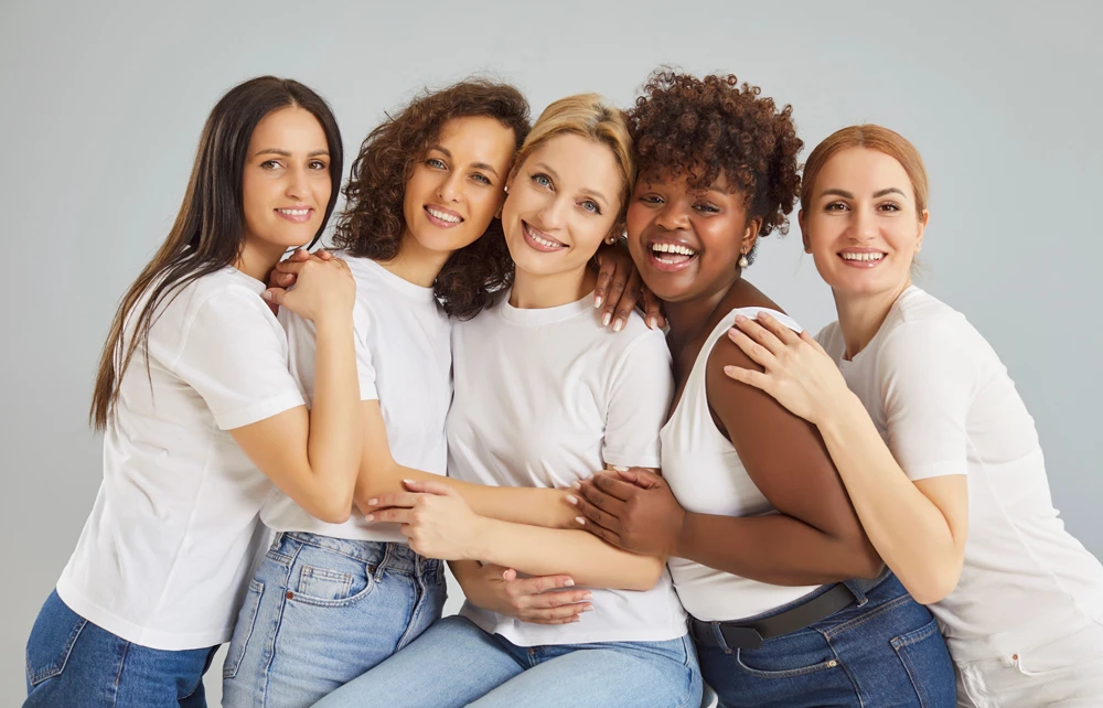 Happy diverse cheerful young women wearing casual clothes